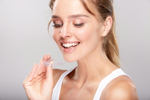 Young woman at dentists Invisalign orthodontics