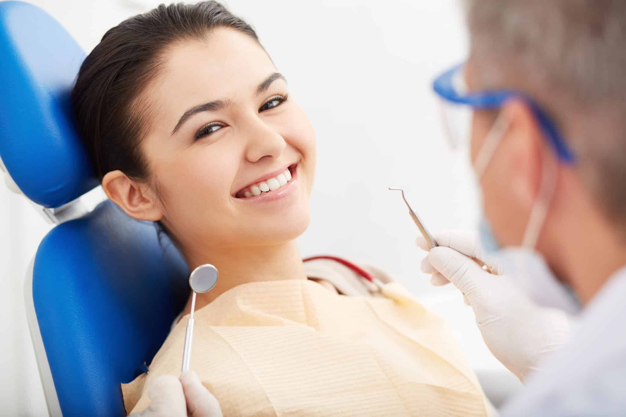 Image,Of,Smiling,Patient,Looking,At,Camera,At,The,Dentistã?â¢??s